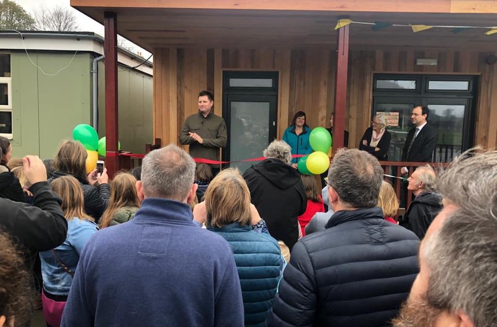 George Clarke cuts the ribbon for eco-classroom at North Nibley