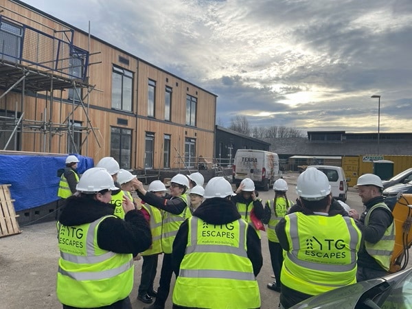 Students enjoy a site visit to learn about sustainable modular construction